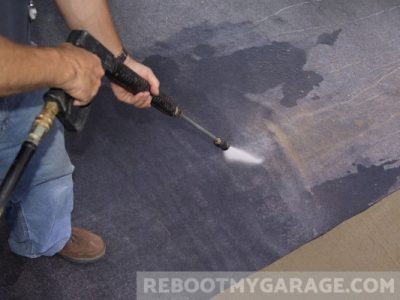 Clean the mat with a pressure washer