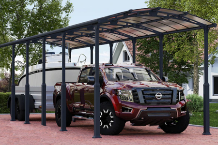 Translucent tough material peaked roof carport with pickup truck underneath